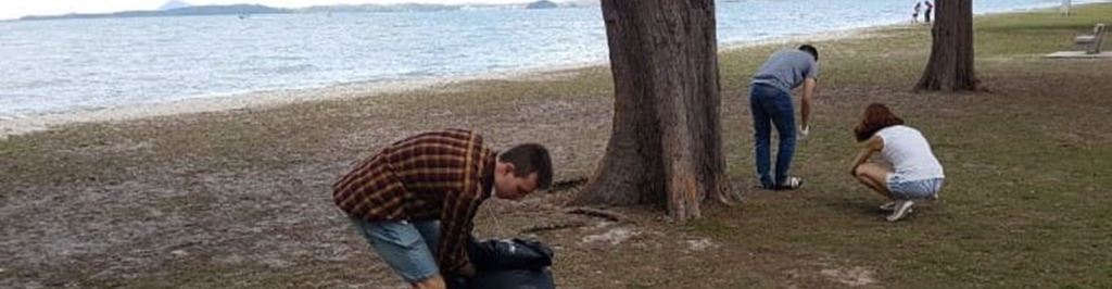 Staff and Students Clean a Beach